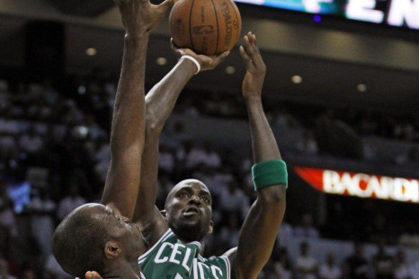 Boston Celtics' Garnett shoots over Miami Heat's Anthony and James during fourth quarter in Miami