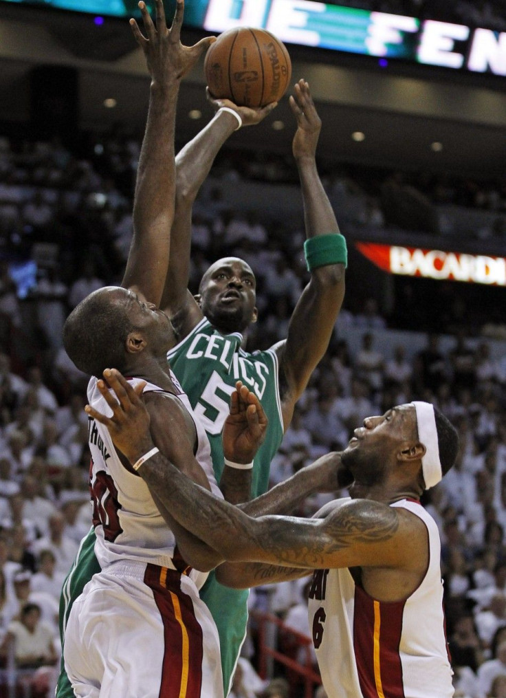 Boston Celtics' Garnett shoots over Miami Heat's Anthony and James during fourth quarter in Miami