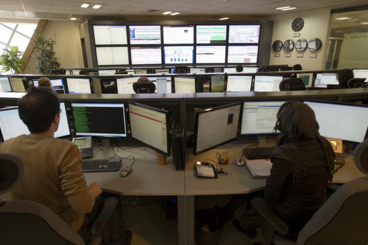 Technicians monitor data flow in the control room of an internet service provider.