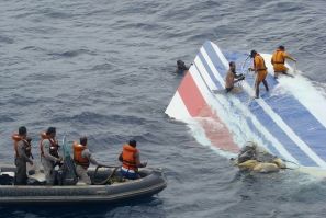 Brazilian Navy sailors pick a piece of debris from Air France flight AF447 out of the Atlantic Ocean
