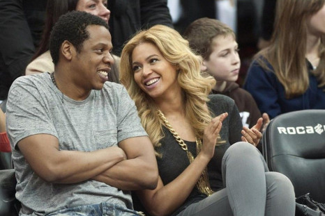 Jay Z and his wife Beyonce watch the New Jersey Nets play the Phoenix Suns in their NBA game in Newark.