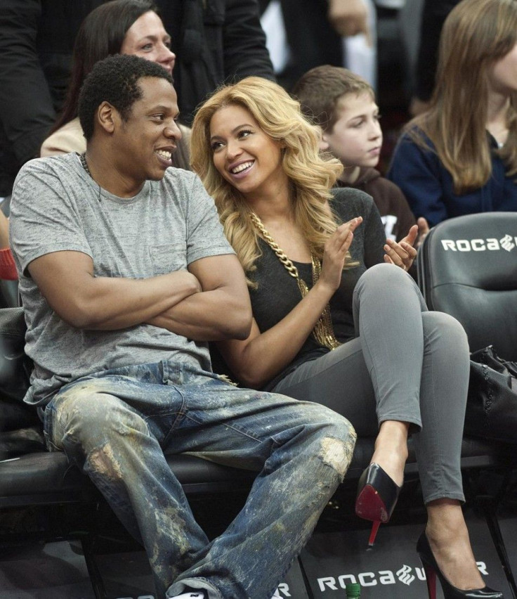 Jay Z and his wife Beyonce watch the New Jersey Nets play the Phoenix Suns in their NBA game in Newark.