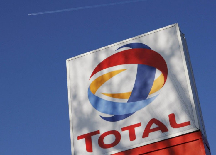 A logo for oil giant Total is seen at a petrol station in London