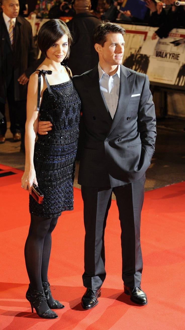 U.S. actor Tom Cruise and his wife Katie Holmes pose on the red carpet at the British premiere of the film Valkyrie at Leicester Square in London