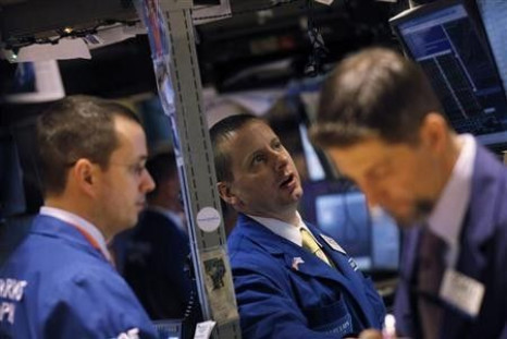 Traders work on the floor of the New York Stock Exchange January 5, 2012.