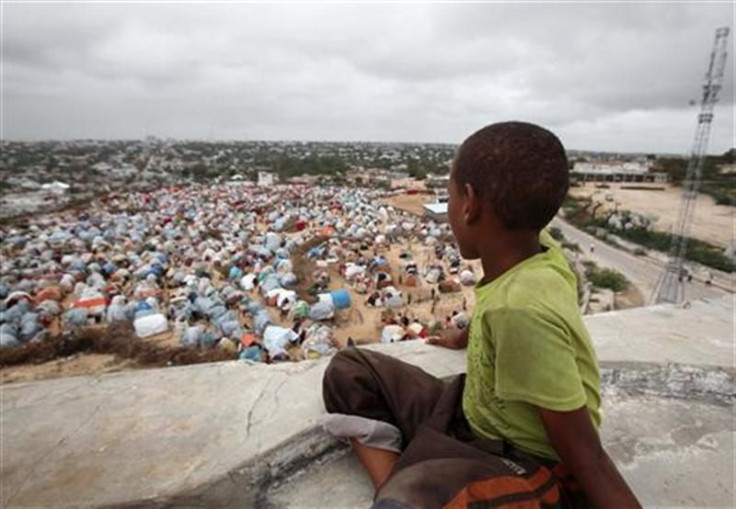 A boy sits looking over the Seyidka settlement for the famine stricken internally displaced people in Berkulan near Somalia&#039;s capital Mogadishu