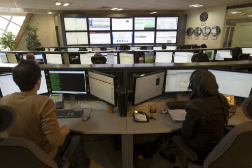 Technicians monitor data flow in the control room of an internet service provider in Tehran .