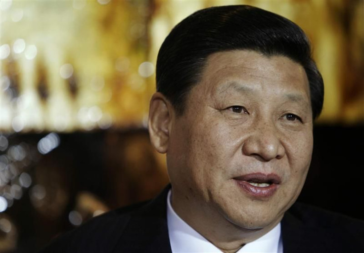 Chinese Vice President Xi Jinping speaks during a visit to the Rick Kimberley family farm, in Maxwell, Iowa