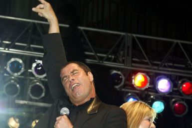 Actor John Travolta (L) and Australian singer Olivia Newton-John perform a song
