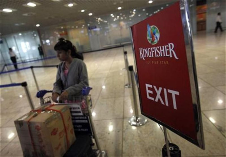 A lone Kingfisher Airlines customer waits in a check-in queue at Mumbai&#039;s domestic airport