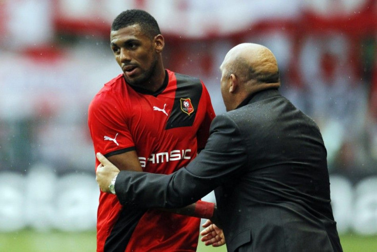 Rennes' Yann M'Vila with  manager Frédéric Antonetti