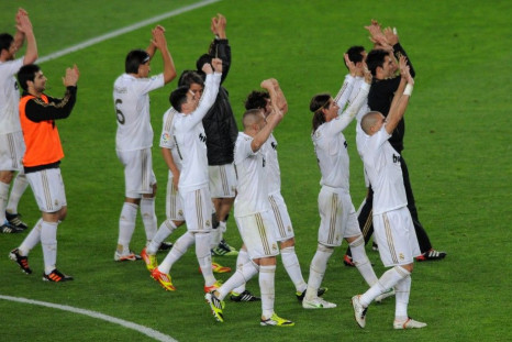 Real Madrid's players celebrate victory over Barcelona at the end of their Spanish first division &quot;El Clasico&quot; soccer match
