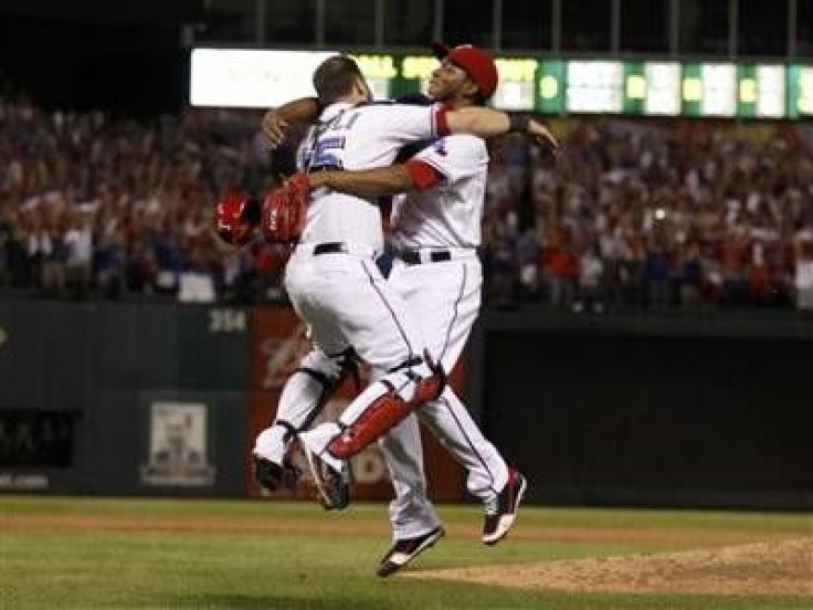 Texas Rangers relief pitcher Neftali Feliz celebrates with catcher Mike Napoli after the Rangers defeated the Detroit Tigers in Game 6 of MLB&#039;s ALCS baseball playoffs to take the pennant in Arlington