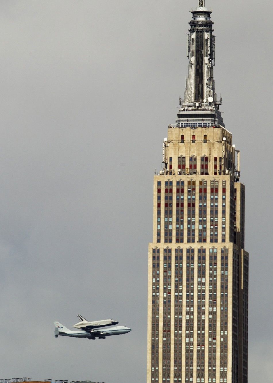 Space shuttle Enterprise rides atop NASA modified 747 plane over New York