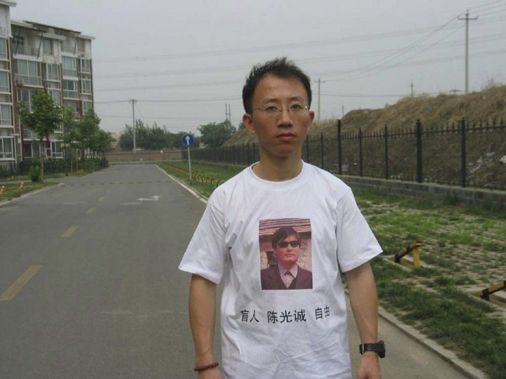 One of China's most prominent dissidents, Hu Jia, wears a shirt in support of blind Chinese lawyer Chen Guangcheng, in this undated handout.