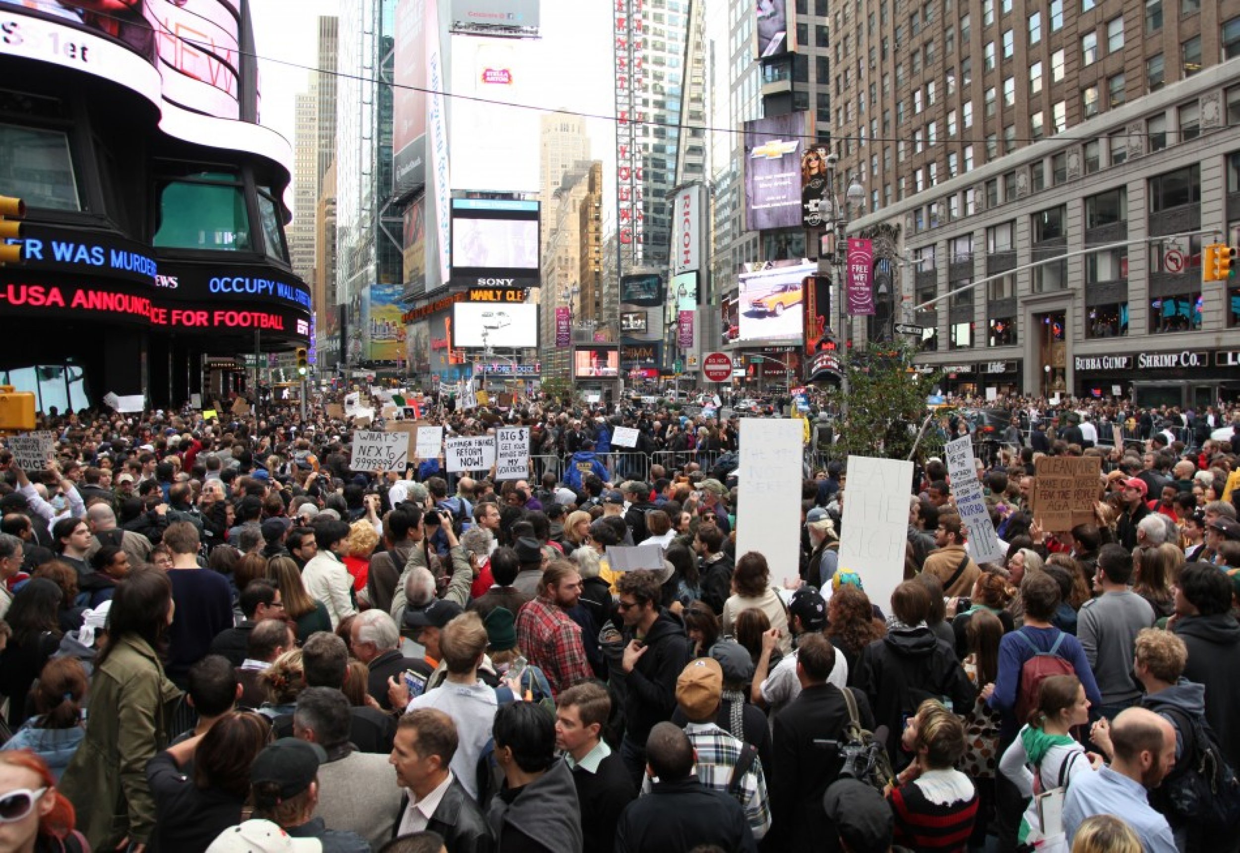 Protesters Cheer at Times Square News Ticker