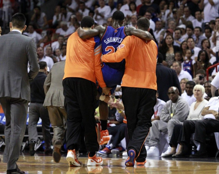 Knicks&#039; guard Iman Shumpert is carried off the floor after tearing his ACL.