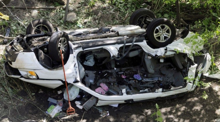 The wreckage of a van that drove off a highway overpass near the Bronx Zoo in New York