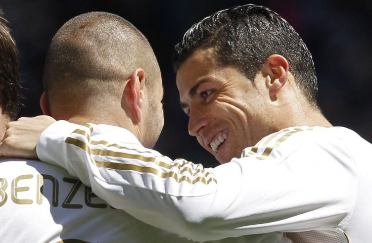 Watch highlights of Real Madrid's 3-0 victory over Sevilla, featuring goals from Cristiano Ronaldo and Karim Benzema.
