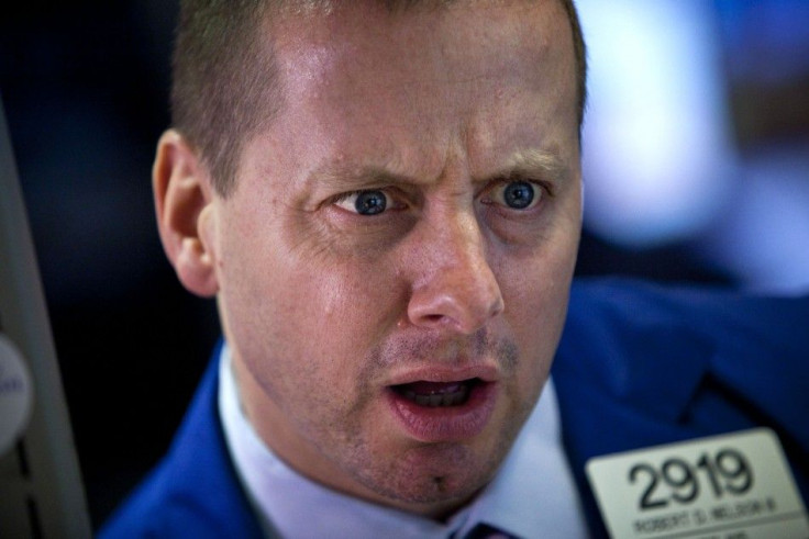 A trader works on the floor of the New York Stock Exchange at the end of the trading day, in New York