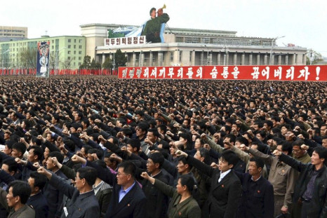 North Korean people and soldiers attend a rally denouncing South Korean President Lee Myung-bak at the Kim Il Sung Square in Pyongyang