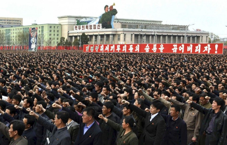 North Korean people and soldiers attend a rally denouncing South Korean President Lee Myung-bak at the Kim Il Sung Square in Pyongyang