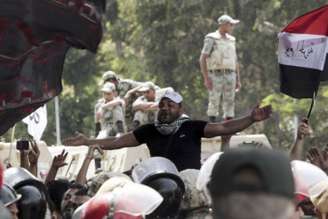 11 killed and 160 injured when unknown attackers storm anti-military protest in Cairo.
