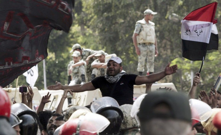 11 killed and 160 injured when unknown attackers storm anti-military protest in Cairo.