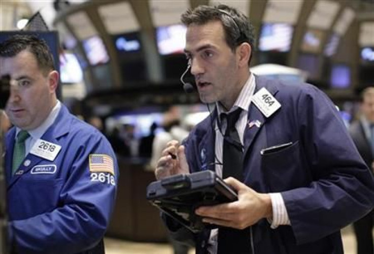 Traders work on the floor of the New York Stock Exchange