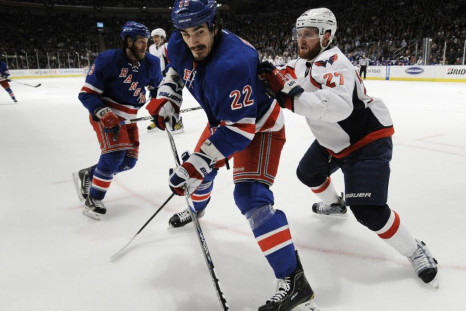 New York Rangers&#039; Boyle and Washington Capitals&#039; Alzner battle along the boards during the second period in Game 2 of their NHL Eastern Conference semi-final playoff hockey game at Madison Square Garden in New York