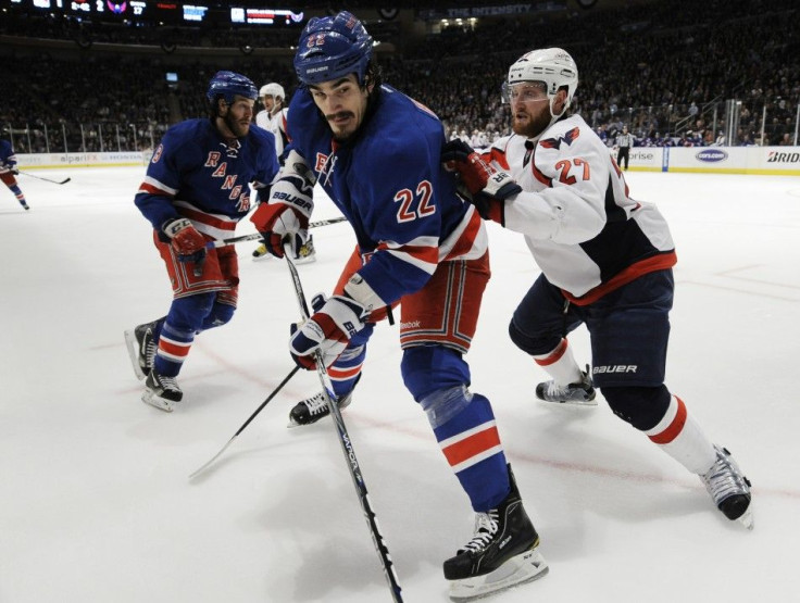 New York Rangers&#039; Boyle and Washington Capitals&#039; Alzner battle along the boards during the second period in Game 2 of their NHL Eastern Conference semi-final playoff hockey game at Madison Square Garden in New York