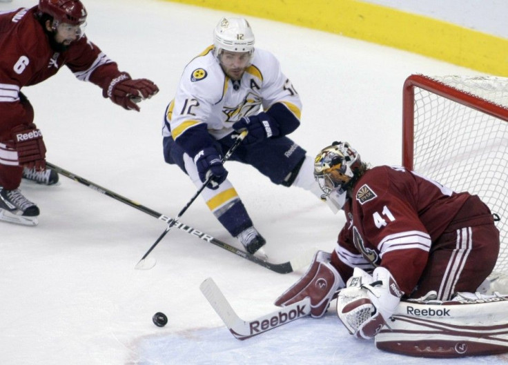 Coyotes goalie Mike Smith makes 3rd period save on Predators center Mike Fisher during Game 2 of the NHL Western Conference semi-final hockey playoffs.