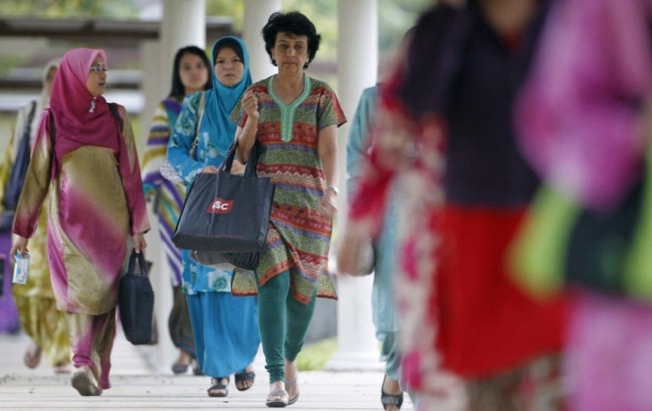 Workers arrive at their offices in Putrajaya