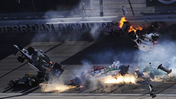The race car of driver Will Power goes airborne during the IZOD IndyCar World Championship race at the Las Vegas Motor Speedway in Las Vegas
