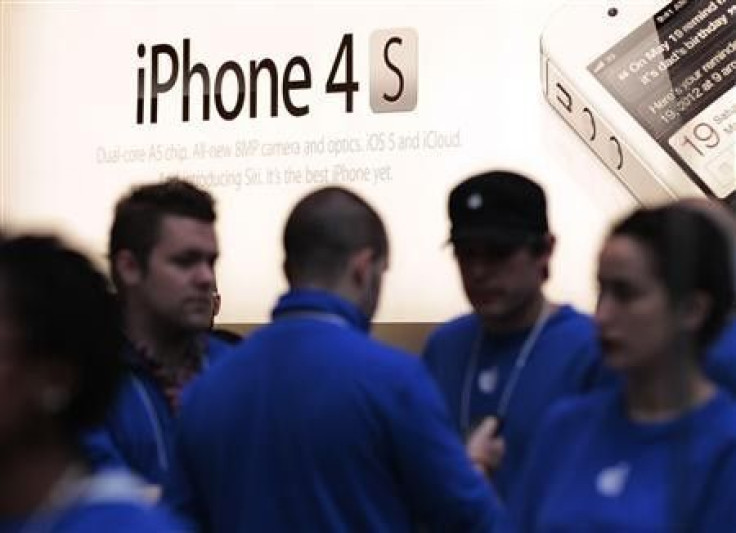 A sign for the iPhone 4S is seen at an Apple Store in New York