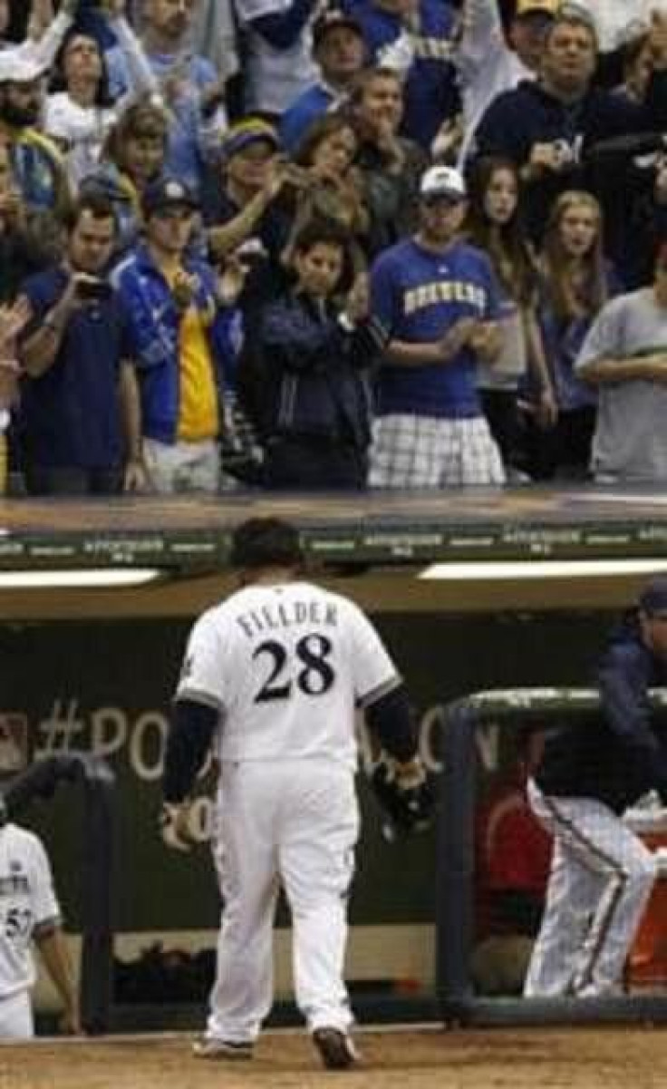 Milwaukee Brewers first baseman Prince Fielder leaves the field after grounding out against the St. Louis Cardinals during the eighth inning of Game 6 of the NLCS baseball playoffs in Milwaukee, Wisconsin