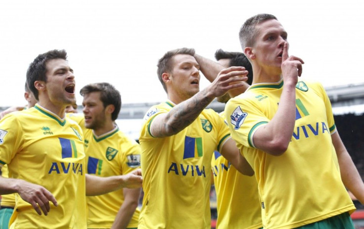 Norwich celebrates a goal by quieting Anfield.