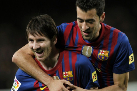 Lionel Messi celebrates with Sergio Brusquets after one of his four goals.