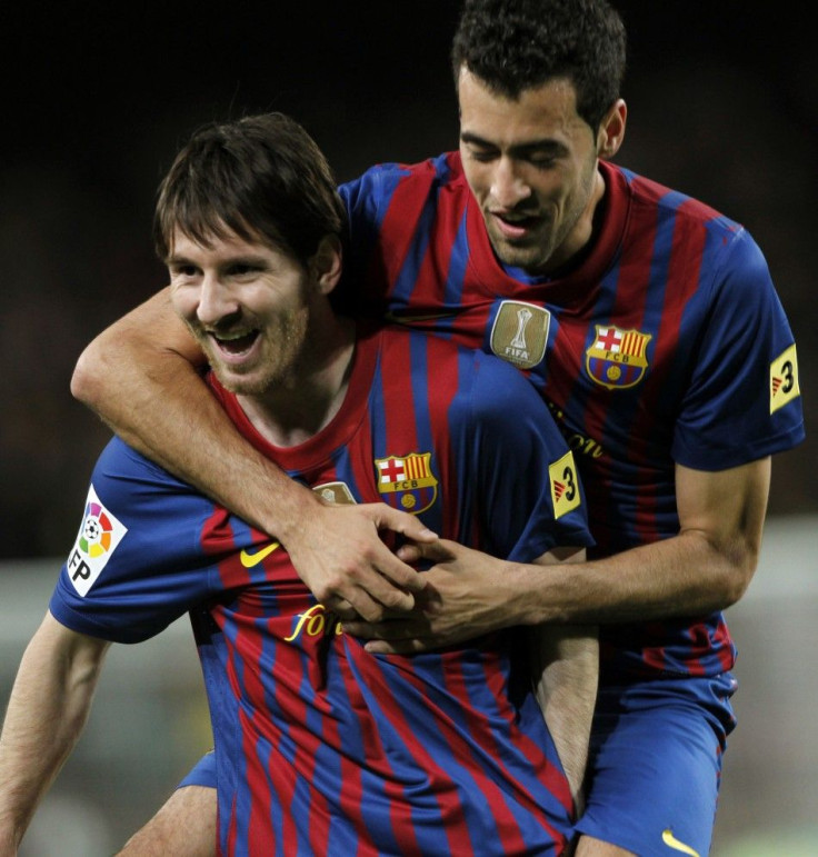 Lionel Messi celebrates with Sergio Brusquets after one of his four goals.