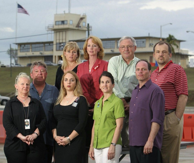 Family members of the 9/11 victims pose for a photograph at U.S. Naval Base Guantanamo Bay, where they came to witness the arraignment of five prisoners accused of plotting the September 11 attacks, May 5, 2012.