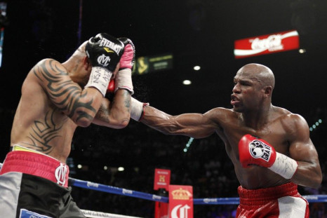 Floyd Mayweather punches Miguel Cotto during their fight Saturday night.