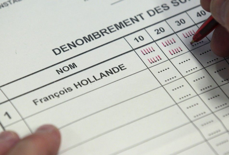 An election official counts votes for Socialist Party candidate Hollande from the second round in the 2012 French presidential election in Illkirch-Graffenstaden