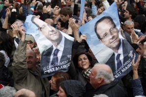 Supporters of Francois Hollande, Socialist party presidential candidate, react after results in the second round vote of the 2012 French presidential elections in Tulle