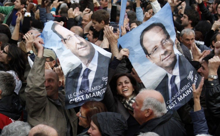 Supporters of Francois Hollande, Socialist party presidential candidate, react after results in the second round vote of the 2012 French presidential elections in Tulle