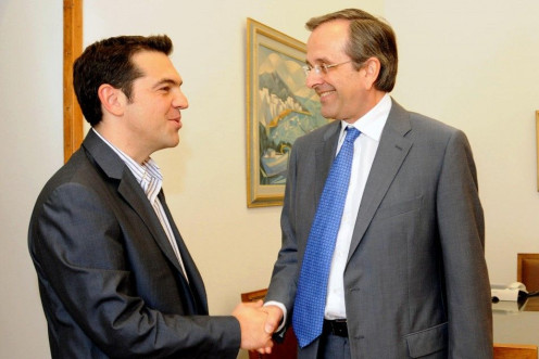 Greek conservative party leader Samaras shakes hands with Head of Greece&#039;s Left Coalition party Tsipras at the parliament in Athens