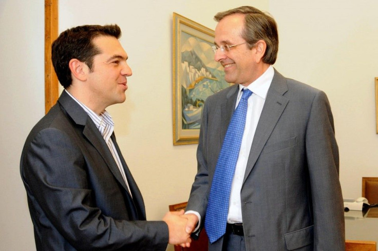 Greek conservative party leader Samaras shakes hands with Head of Greece&#039;s Left Coalition party Tsipras at the parliament in Athens