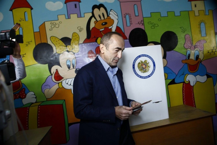 Former Armenian President Kocharyan walks to cast his ballot during a parliamentary election in Yerevan