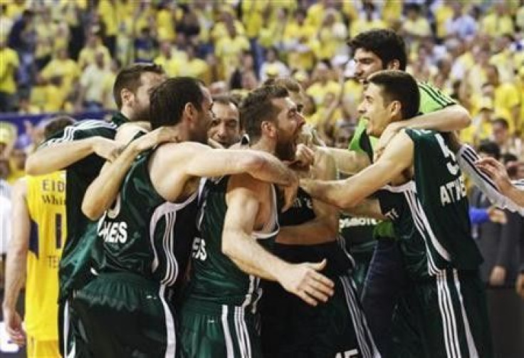 Panathinaikos' players celebrate after defeating Maccabi Tel Aviv at the end of their Euroleague Final Four final basketball game at the Palau Sant Jordi in Barcelona