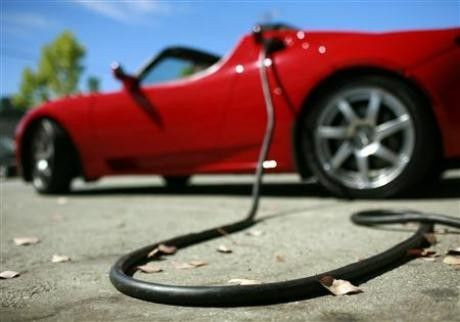 A Tesla Roadster is electrically charged at Tesla Motors in San Carlos, July 22, 2009.