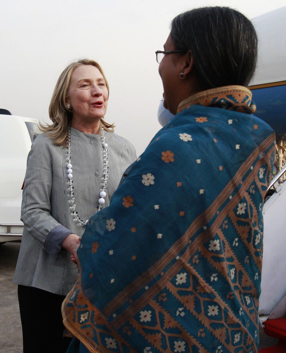 U.S. Secretary of State Hillary Clinton L greets Bangladeshs Foreign Minister Dipu Moni after arriving at Hazrat Shahjalal International Airport in Dhaka May 5, 2012. A senior U.S. State Department official said Clintons visit would highlight growing 